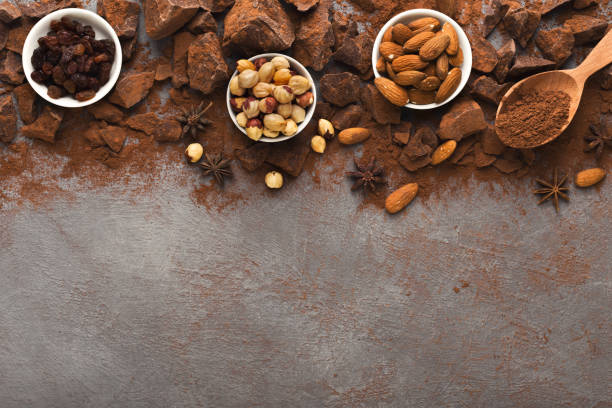 istock Crushed chocolate pieces and cocoa on gray background, top view 965480886