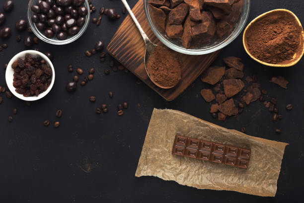 istock Top view on chocolate and nuts on black background 965481066