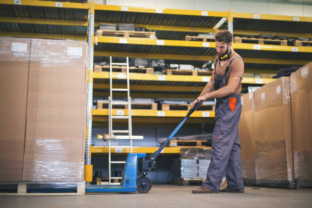 istock Young man checking stuff in storage room in factory 965484146