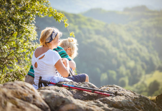 istock Senior women resting at mountain peak 965484330
