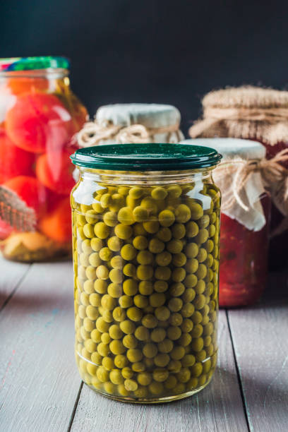 istock Preserved vegetables on wooden background 965484710