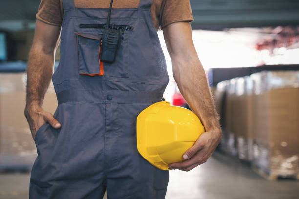 istock Young man checking stuff in storage room in factory 965484784