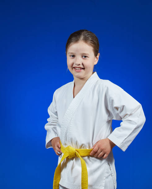 istock On a blue background a beautiful sportswoman 965485412