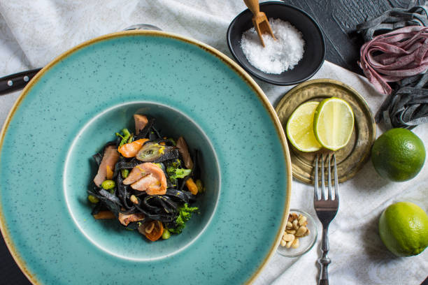 istock Black Pasta Spaghetti from Squid Ink with Salmon and Vegetables 965491562