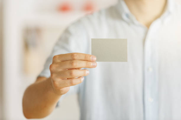 istock Male holding empty business card 965491792
