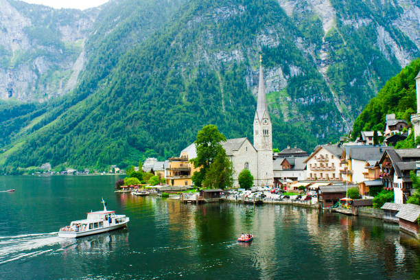 istock Hallstatt town and lake with boat in Austria 965491992