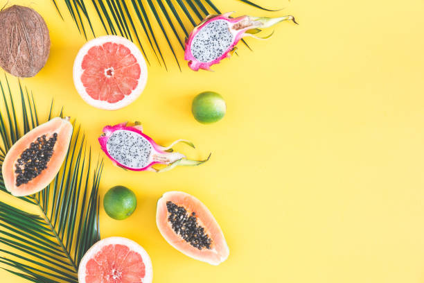 istock Summer fruits on yellow background. Flat lay, top view 965492224