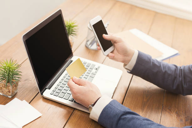 istock Unrecognizable businessman typing on laptop 965496184