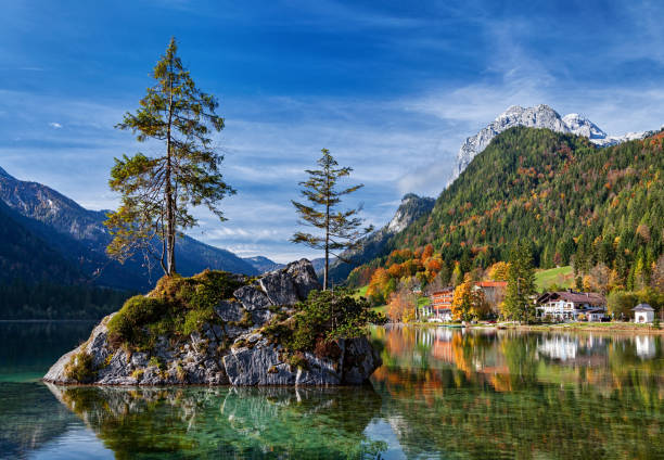 istock Autumn forest reflected in calm lake. Hintersee lake in Berchtesgaden park, Germany. 965496418