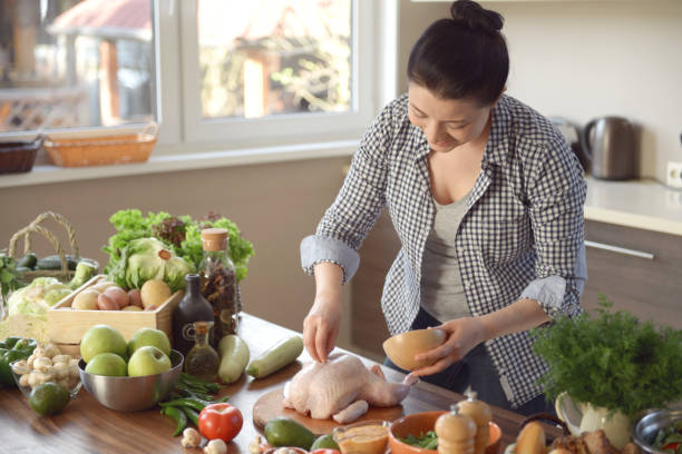 istock woman cooking in the kitchen 965499742