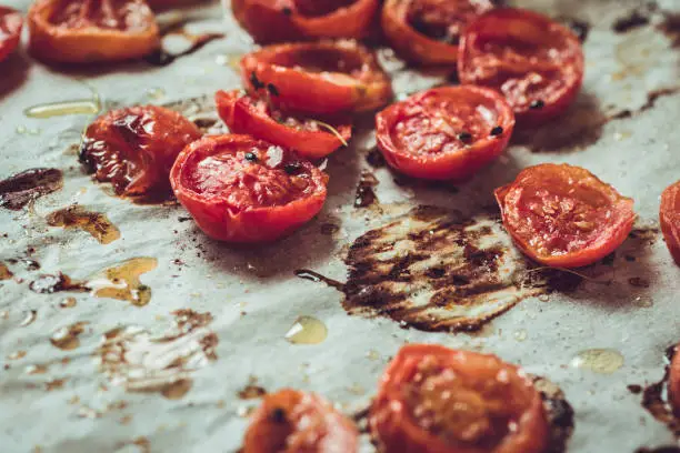 Rustic Style Roasted Cherry Tomatoes on White Baking Parchment