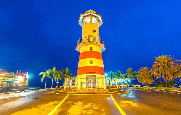 istock lighthouse at night in Trad province Thailand 965504352