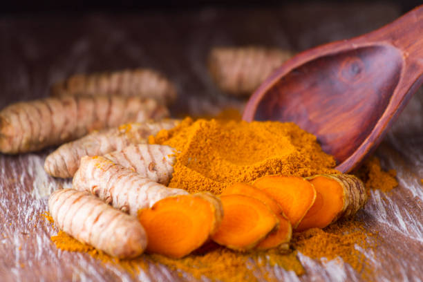 istock turmeric powder and roots 965506966