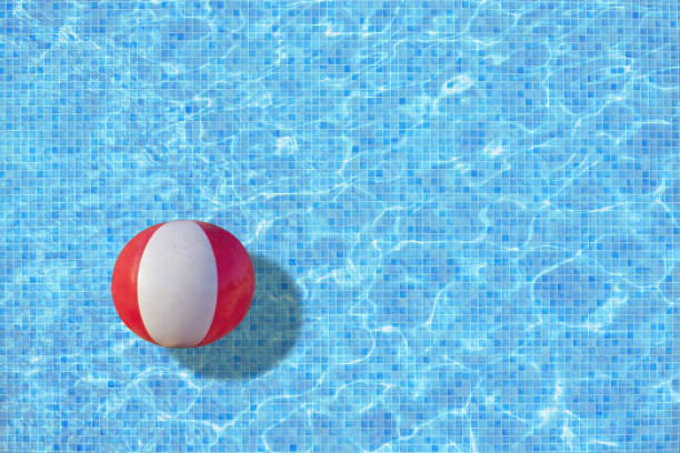 istock Ball in turquoise mosaic pool 965507586