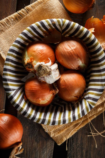 istock Still life of fresh onions and garlic head. 965507664