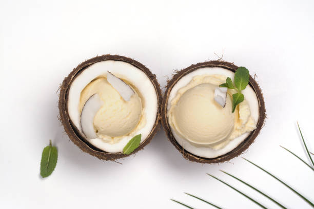 istock Coconut ice cream scoops in halves of coconut shell 965510340