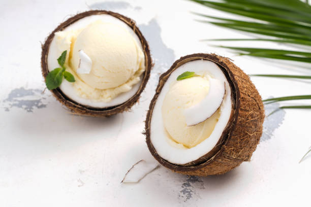 istock Coconut ice cream scoops in halves of coconut shell 965510982