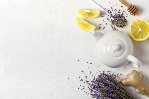 istock Lavender herbal tea in a white teapot, lemon and ginger 965514318