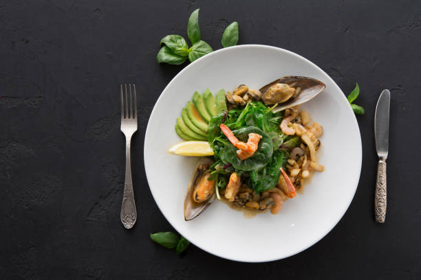 istock Warm salad with grilled seafood flat lay 965515652