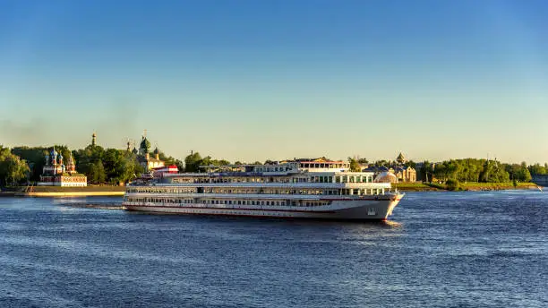 Cruise ship on the Volga River against the backdrop of the ancient Russian town of Uglich. Golden ring of Russia.