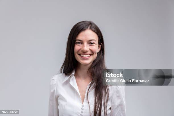 Young Longhaired Smiling Woman In White Shirt Stock Photo - Download Image Now - Portrait, One Woman Only, Smiling