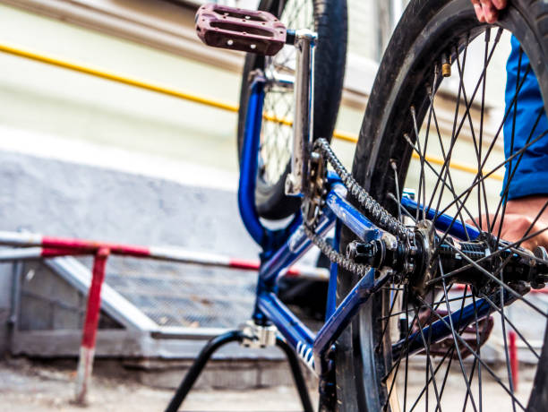 istock close up bicycle man repairing the chain 965524390
