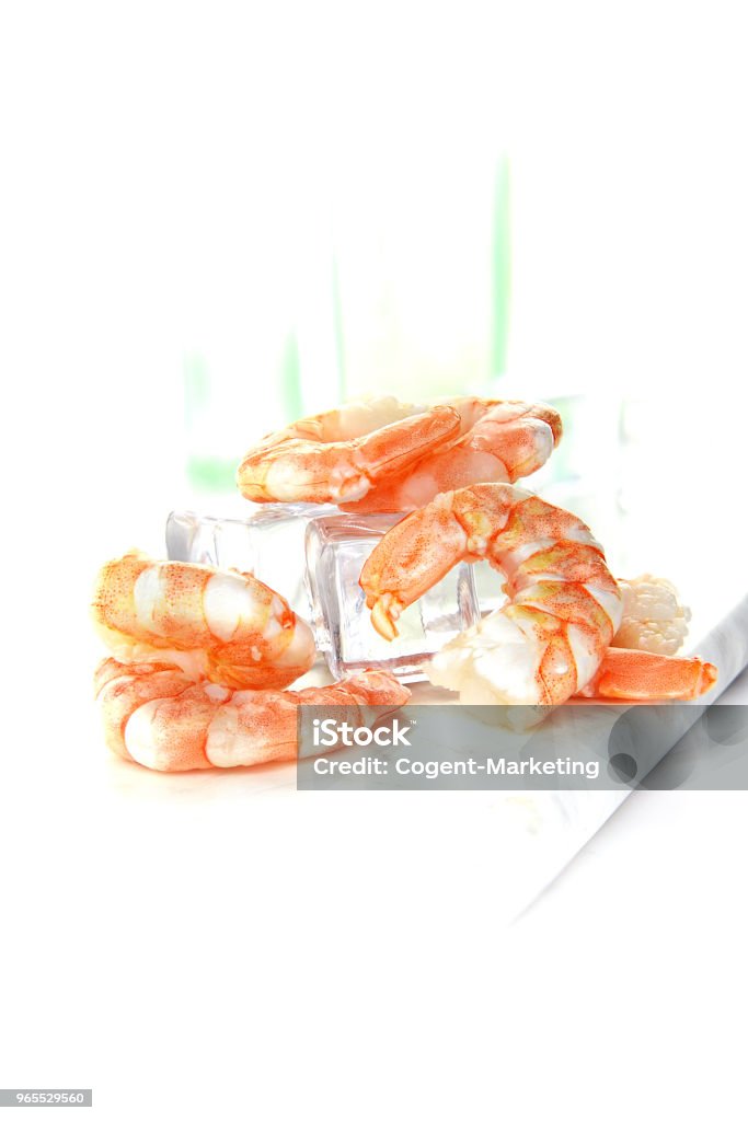 King Prawns on Ice Fresh King Prawns on ice shot against a bright background with generous accommodation for copy space. Concept image for healthy diet and eating. Animal Stock Photo