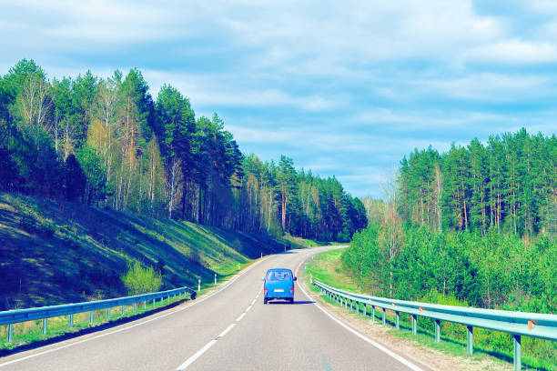 istock Car on road at countryside toned 965532852