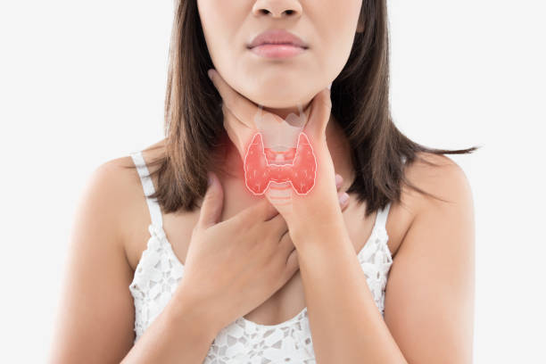 Women thyroid gland control The photo of thyroid is on the human body, Women thyroid gland control. Sore throat of a people against gray background. follicular thyroid cancer stock pictures, royalty-free photos & images