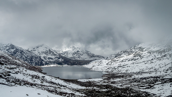 Sarathang lake surrounded by snow covered mountains on all side near Changu lake in May, Sikkim, India