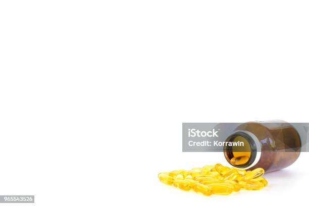 Healthy Diet Conceptfish Oil Capsules With Omega 3 And Vitamin D Overflow Form A Glass Bottle Isolated On A White Background Stock Photo - Download Image Now