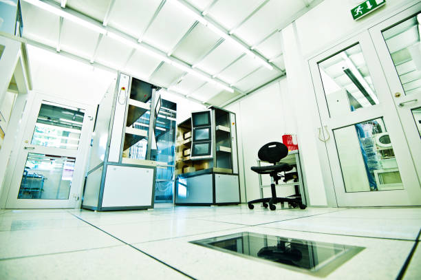 A Cleanroom Wide angle image of a semiconductor fabrication cleanroom cleanroom stock pictures, royalty-free photos & images