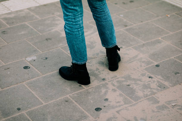istock black rough hipster boots and squatters outfit with blue jeans 965551060