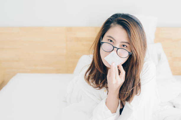 istock Asian women holding condom in her hand. 965557392