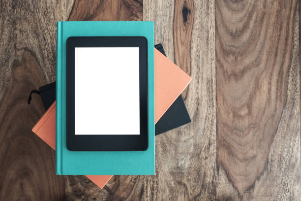 istock top view of e-book reader on stack of books on wooden table 965557650