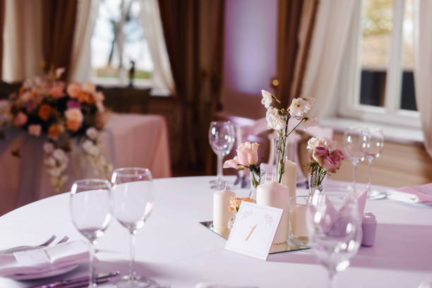 istock Wedding tables set for banquet or wedding event catering. Party celebration wedding concept. Flowers wedding decoration of tables for guests of bride and groom. Table appointment event 965564554