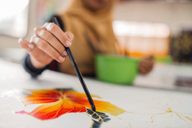 istock Asian woman working in Batik workshop 965567054