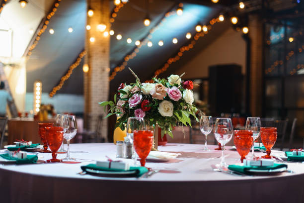istock Wedding tables set for banquet or wedding event catering. Party celebration wedding concept. Flowers wedding decoration of tables for guests of bride and groom. Table appointment event 965567112