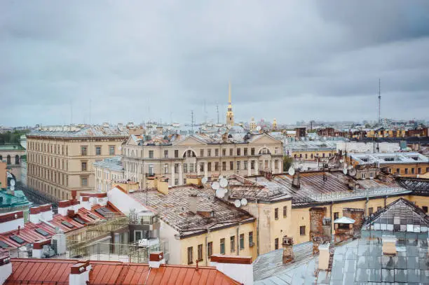 Beautiful aerial cityscape. Rainy day at Saint-Petersburg, Russia. Rooftop view on old buildings and St Isaac Cathedral. Russia tourism to St Petersburg roof. City landscape