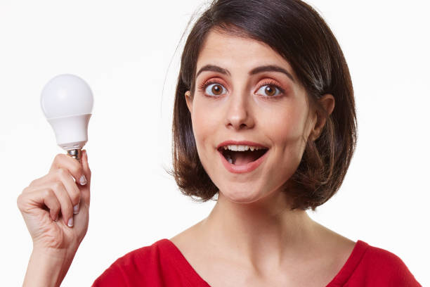 istock cute and beauty young woman holding light bulb 965581684