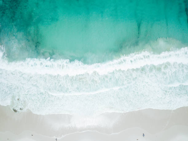 istock Aerial View of Waves Crashing on Sandy Beach 965584804