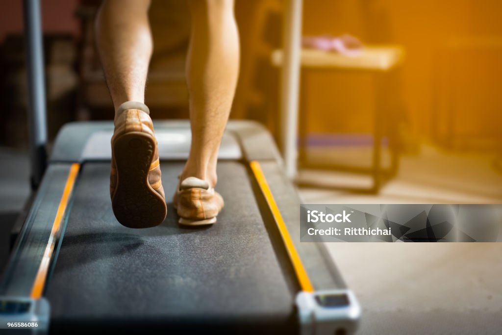 Running exercise in gym fitness Treadmill Stock Photo