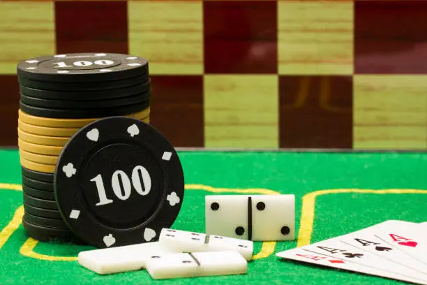 Photo of concept of board games objects for playing poker dominoes