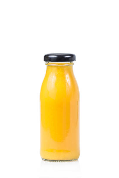 istock Pineapple juice in bottle isolated on white background 965589880