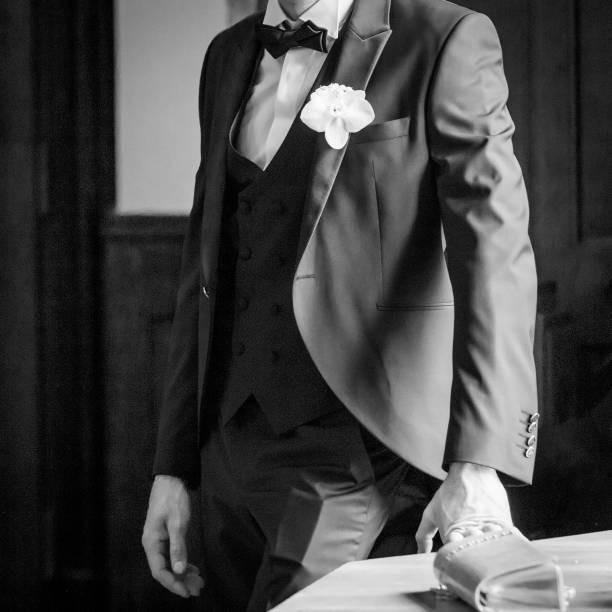 istock Groom in elegant black suit 965593686