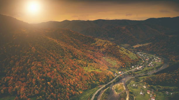 istock Aerial View: autumn canyon village along the river 965607210