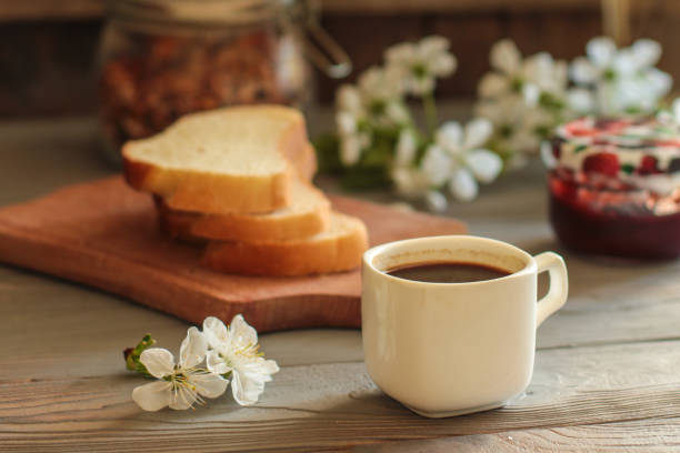 istock black coffee in a white cup and flowers (portion of hot coffee) 965607436