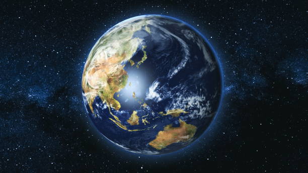 istock Realistic Earth Planet against the the star sky 965607578