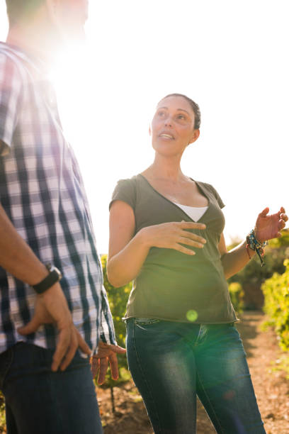 istock Happy people spending time in the vineyards 965628732