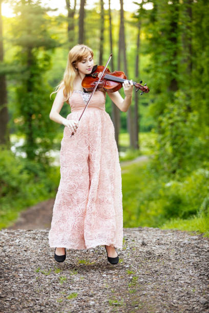 istock Beautiful Young Viola Player in Midair 965644266
